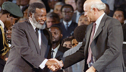 Sam Nujoma and FW de Klerk shake hands as Namibia gains Independence - March 1990